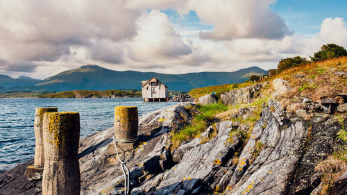 Panoramic view of sea and buildings against sky