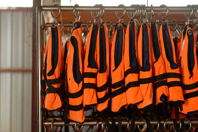 Close-up of clothes hanging on rack