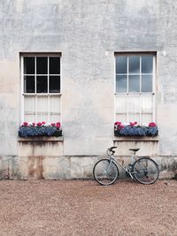 Bicycle parked in front of building