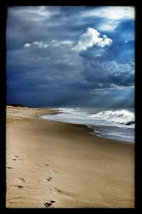 Scenic view of beach against sky