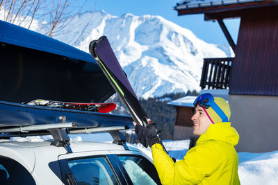 Rear view of man skiing on snow