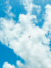 Low angle view of kite flying against sky
