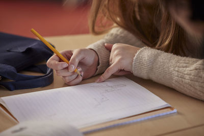 Student taking notes in class