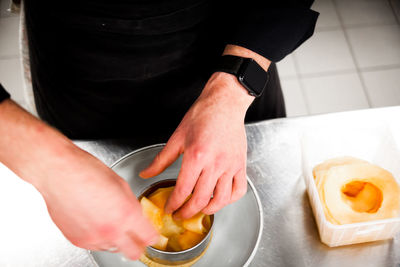 Midsection of man preparing food
