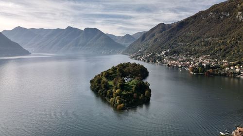 Scenic view of como lake  omacina island and mountains against sky