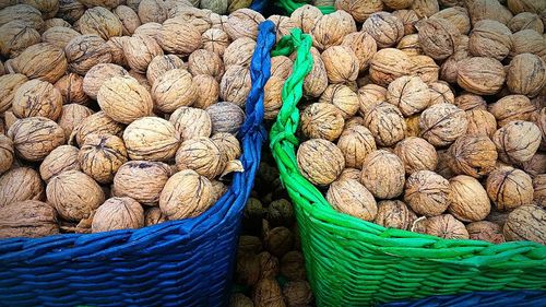 Close-up of walnuts in wicker baskets for sale
