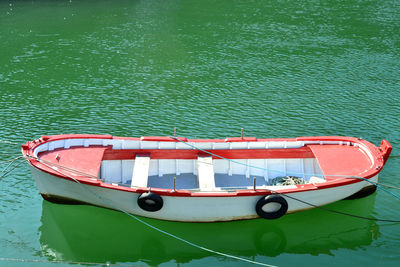 High angle view of red boat moored in lake