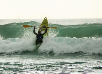 People surfing in sea