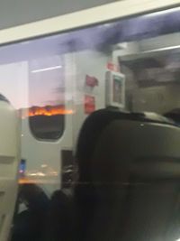 Reflection of train on glass window