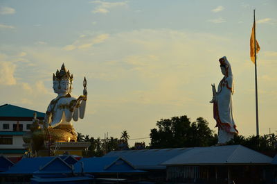 Low angle view of statue against sky