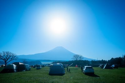 Scenic view of mountains against clear blue sky