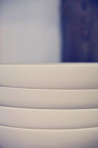 Close-up of stack of window on white wall