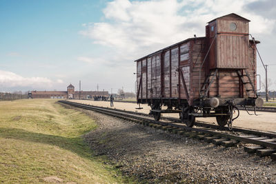 Train on railroad track against sky