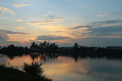 Scenic view of lake against sky during sunset