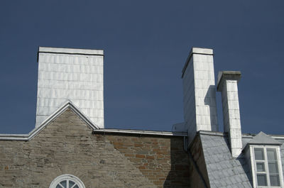 High section of building against clear sky