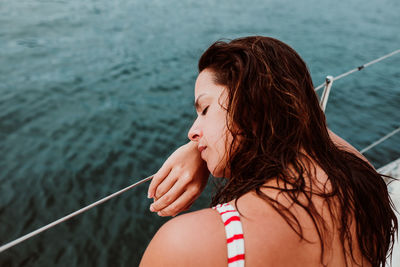 Portrait of woman against sea