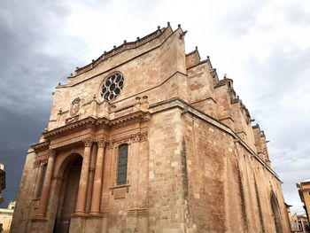 Low angle view of old building against sky