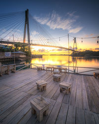 View of suspension bridge against sky during sunset