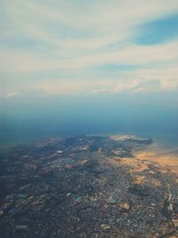 Aerial view of cityscape against sky