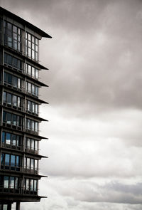 Low angle view of building against cloudy sky