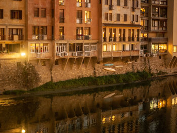 Reflection of buildings in city at night