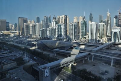 High angle view of buildings in city against sky