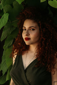 Portrait of a beautiful young woman with leaves