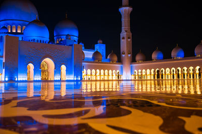 Reflection of illuminated cathedral in water at night