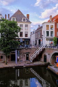 Utrecht, the netherlands. historic houses with wooden stairs leading to the oudegracht canal.