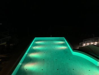 High angle view of illuminated swimming pool at night