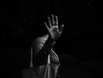 Close-up of human hand against the wall