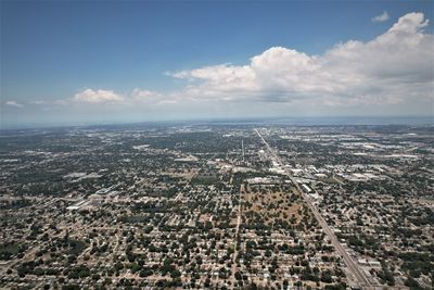 Aerial view of city against sky