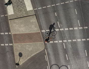 High angle view of man riding bicycle on street