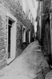 Narrow street along buildings