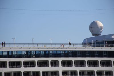 Low angle view of building against clear blue sky