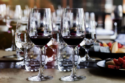 Close-up of wine glasses on table