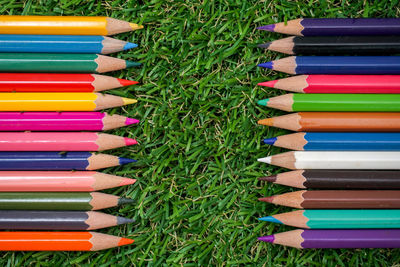 Close-up of multi colored pencils in row