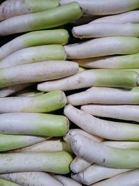 Full frame shot of daikon radish for sale in market