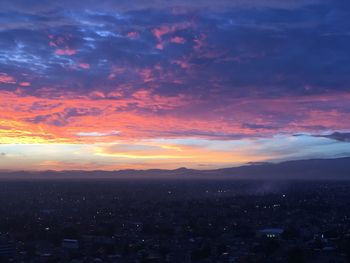 Aerial view of city at sunset