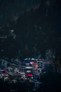 High angle view of illuminated buildings in city at night