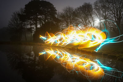 Light trails against sky at night
