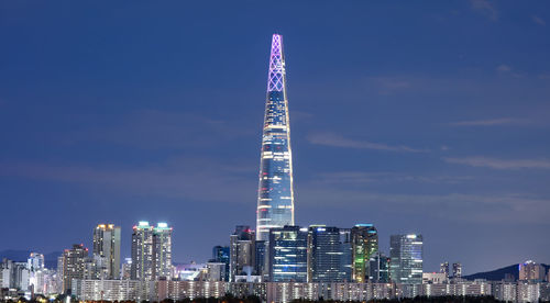 Modern buildings in city against sky