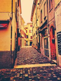 Alley amidst buildings in city