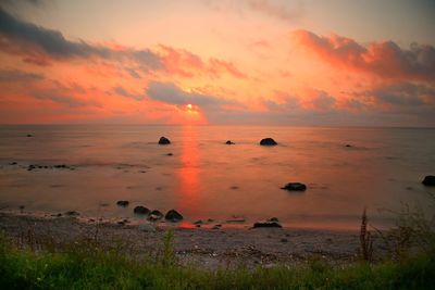 Scenic view of sea against sky during sunset