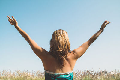 Woman standing on grass