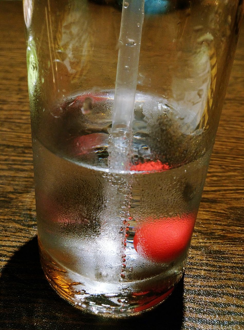 food and drink, drink, drinking glass, refreshment, indoors, close-up, still life, glass - material, freshness, table, transparent, alcohol, ice cube, glass, liquid, ice, cold temperature, drinking straw, cocktail, single object