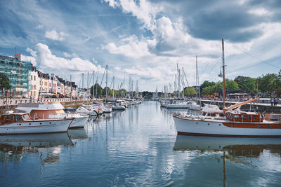 Boats moored at harbor