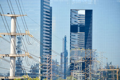 Modern buildings in city against sky