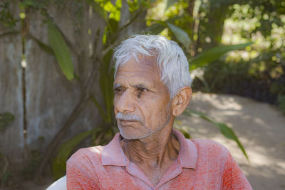 Portrait of man against plants