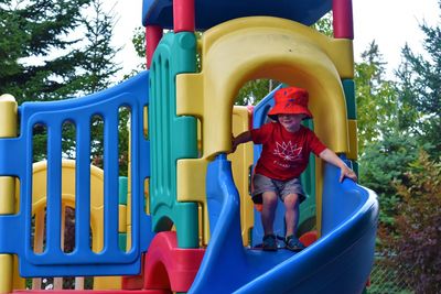 Full length of boy playing in playground